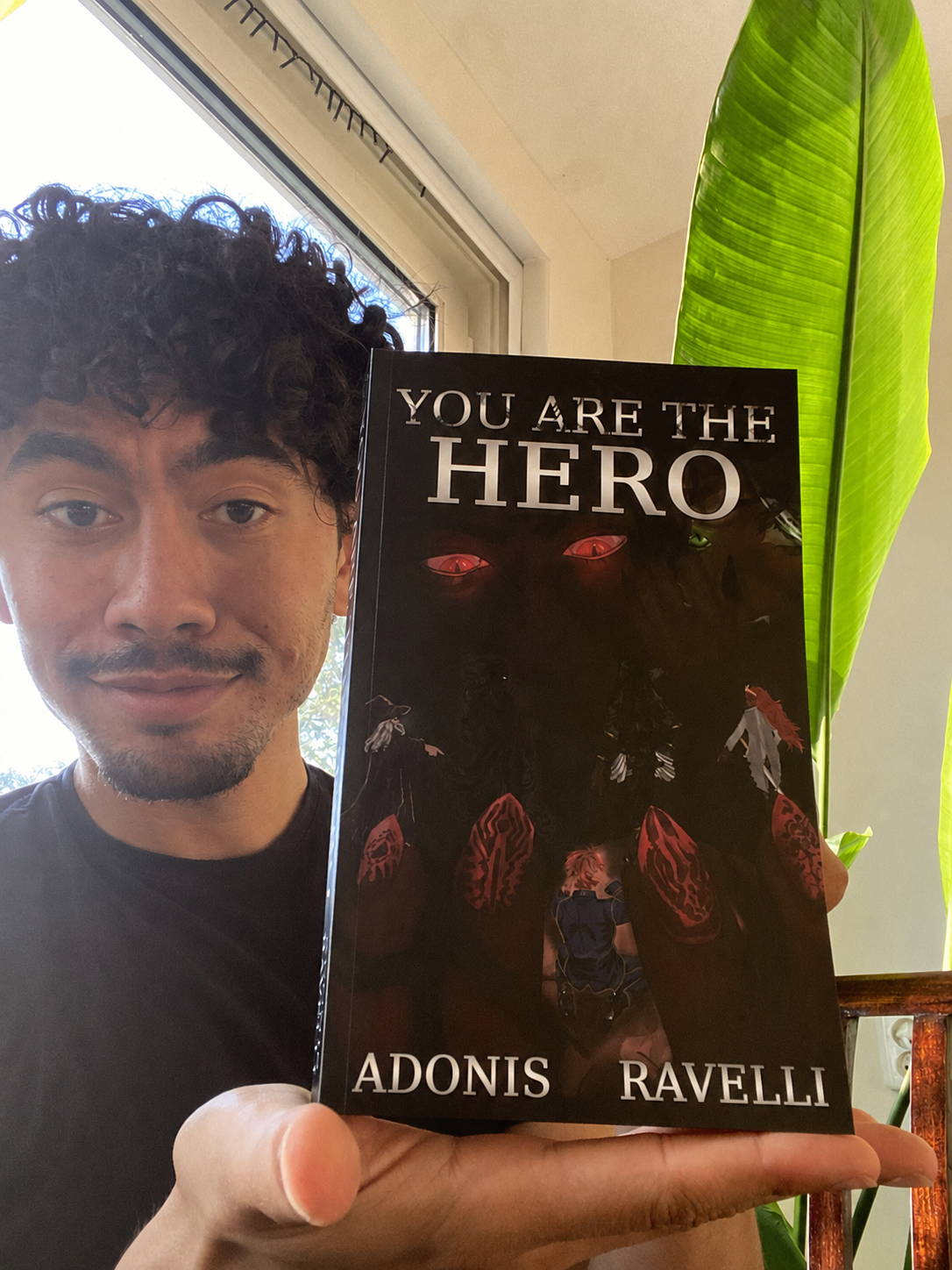 Author showing his book You are the Hero